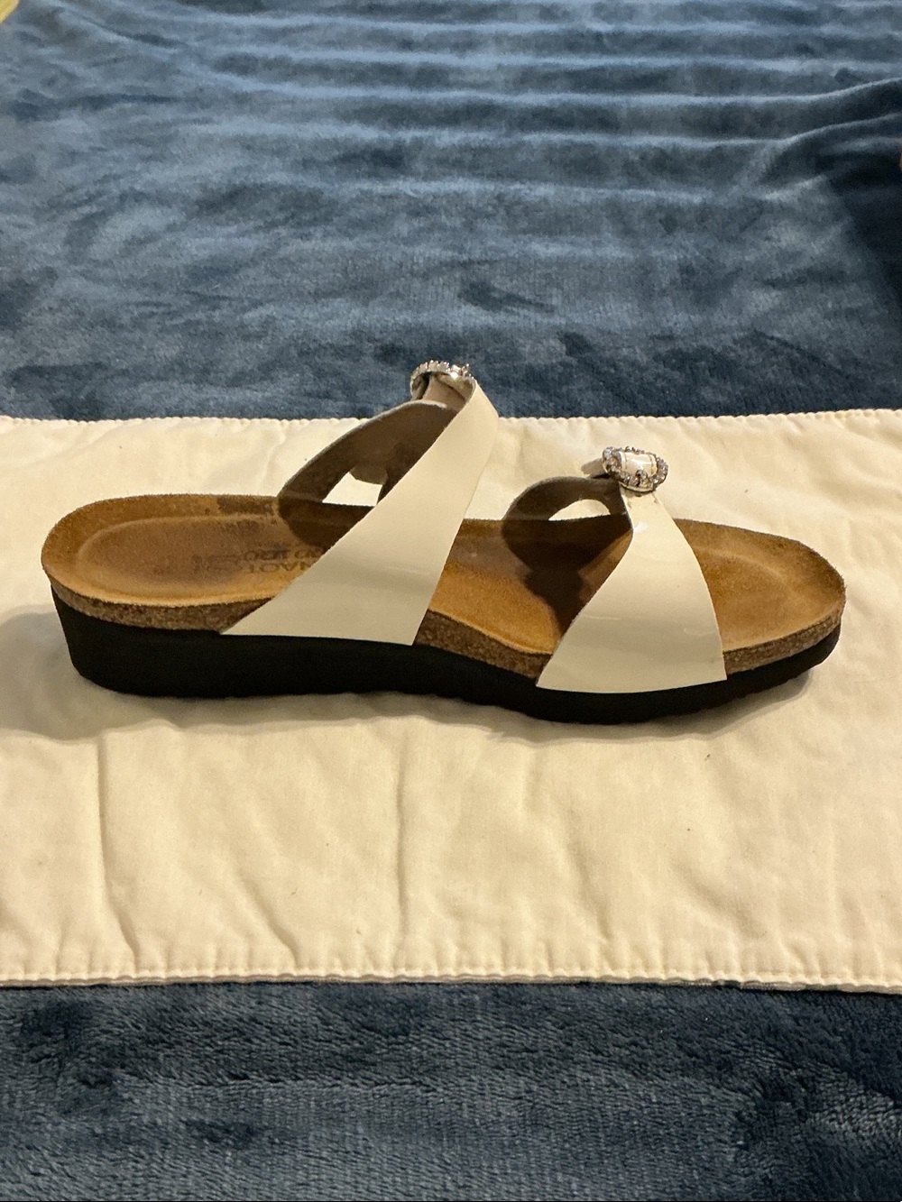 Naot White Leather Crisscross Slide with Decorative Buckle